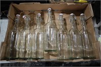BOX OF CLEAR GLASS BOTTLES