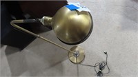 brass colored floor lamp