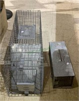 Two live traps - one is approximately 3 feet long