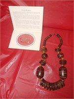 Wooden necklace and a Cleaveland Bay Horse