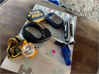 lot of head lamps and flash lights