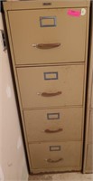 Metal four drawer file cabinet