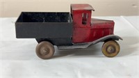 Vintage metal toy truck with wooden wheels