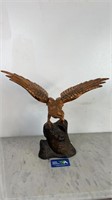 IRON HAWK STATUE ON BRANCH WITH COPPER LOOK