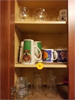 CABINET OF GLASS-  WINE GLASSES, COFFEE MUGS AND M