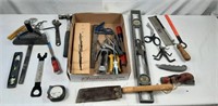 Assortment of tools to include levels, a hammer,