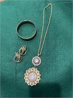 Fashion gold bracelet and pierced earrings,