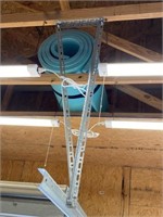 Teal foam pad - in garage rafters