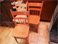 Three side chairs, two with maple finish, one