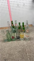12 older glass bottles