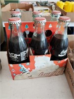 Two (2) miniature Christmas trees/6 pack of Coke