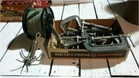 Assorted clamps, grappling hook and roll of straps