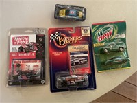 5 race cars,dale earnhardt and jr . richard petty