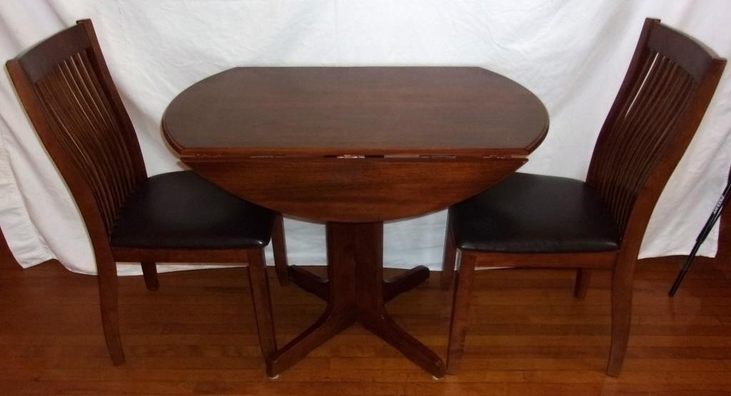 Drop leaf kitchen table w/ 2 chairs.