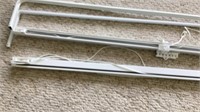 C2) Two 54” traverse curtain rods