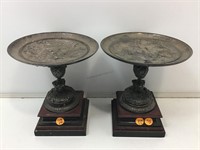 2 Bas Relief Metal Compotes on Wood Bases. 2