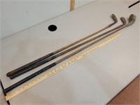 3 antique wood golf clubs