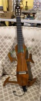 Very peculiar wooden electric six string guitar