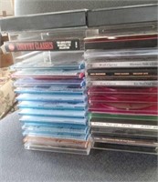 25 PLUS C&W CD'S IN A RACK