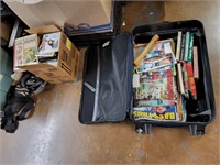 suitcase full of books, magazines and a box