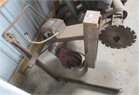 Antique electric motor saw.