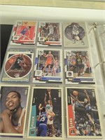 Two binders of basketball cards as shown. P