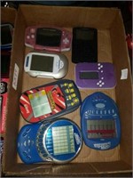 Group of handheld games and 1 pink gameboy