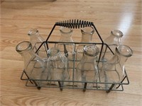 8) Vintage glass milk bottles with metal holder