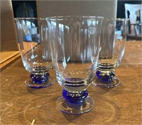 3 clear and blue candle holders/drinking glasses