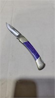 Purple handled buck folding knife