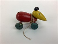 Wooden toy mouse on a string pull toy.  Please