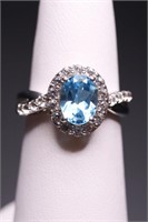 Sterling oval cut blue topaz ring, lab created