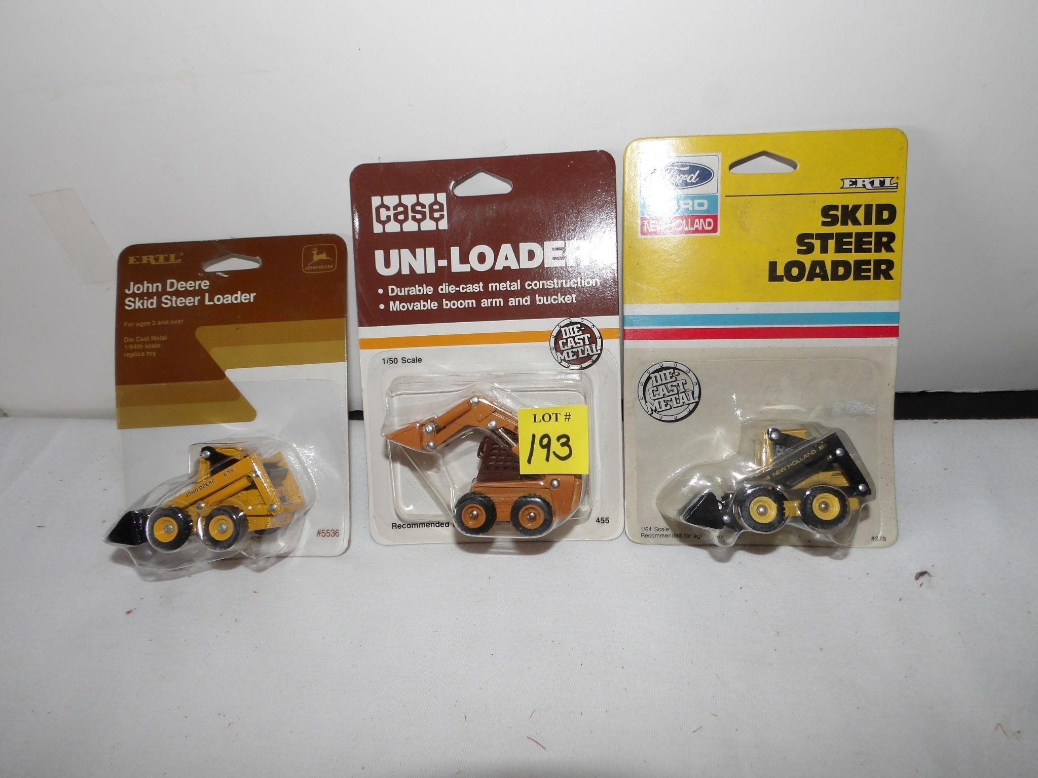 3- 1/64th Skid Loaders