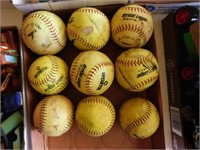9 softballs: 8 Official League Worth brand