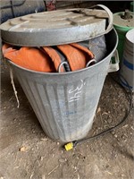 Garbage can with a tarp in it