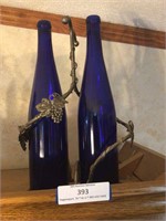 (2) Blue Glass Bottles & Metal Holder