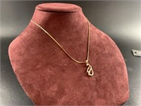 10 kt Gold necklace with 10kt gold pendant with  p