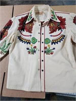 N Turk Embroidered shirt size is faded medium is