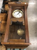 Vintage wall clock with key and pendulum