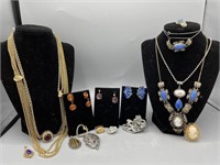 Collection of costume jewelry including slide