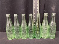 (7) Vintage Dr. Pepper 10-2-4 Embossed Bottles