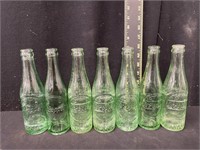 (7) Vintage Dr Pepper 10-2-4 Embossed Bottles