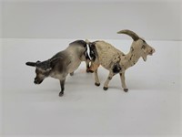 Antique cast iron bull and plastic goat toy