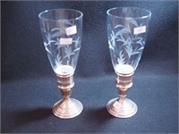 Pair of weighted sterling silver candleholders,