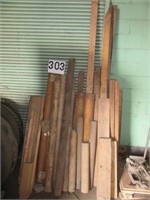 Group of Round Wooden Equipment Rollers and Lumber