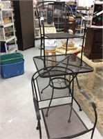 Black iron table with two chairs