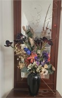 Large black vase with beautiful faux flowers