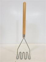 Large potato masher with wood handle