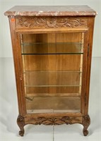 Oak curio cabinet, brown marble top, carved