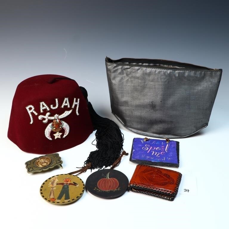 Vintage Masonic Rajah hat, belt buckle, and a wall